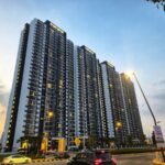 Apartment buildings at dusk with lit windows