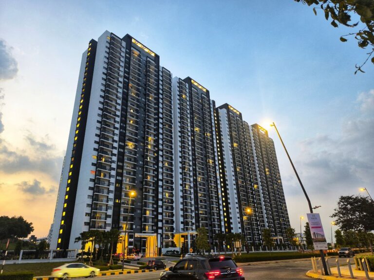 Apartment buildings at dusk with lit windows
