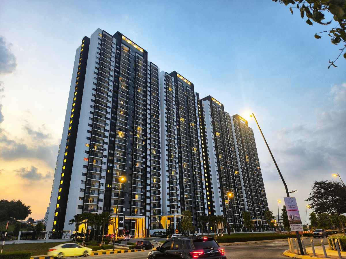 Apartment buildings at dusk with lit windows